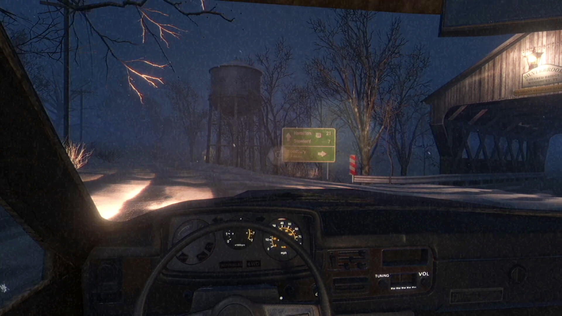 Fears to Fathom: Woodbury Getaway screenshot: driving past a covered bridge in the snow